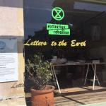 Letters to the Earth sign in shopfront Letters to the Earth sign in shopfront