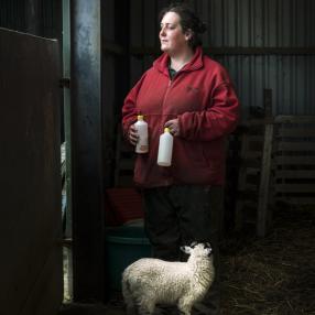 Shepherdess with lamb