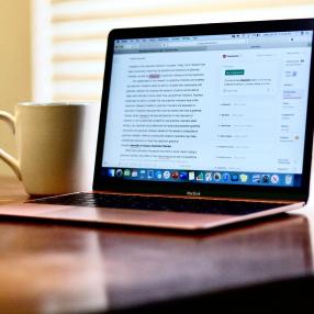 computer screen and coffee cup