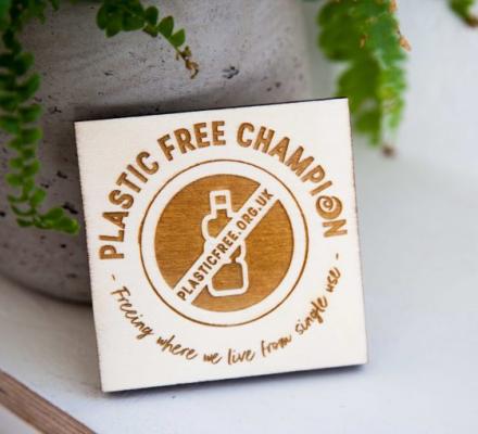 Plastic Free Business Champion plaque next to pot plant